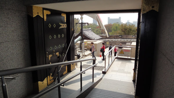 large wooden gates with gold accents